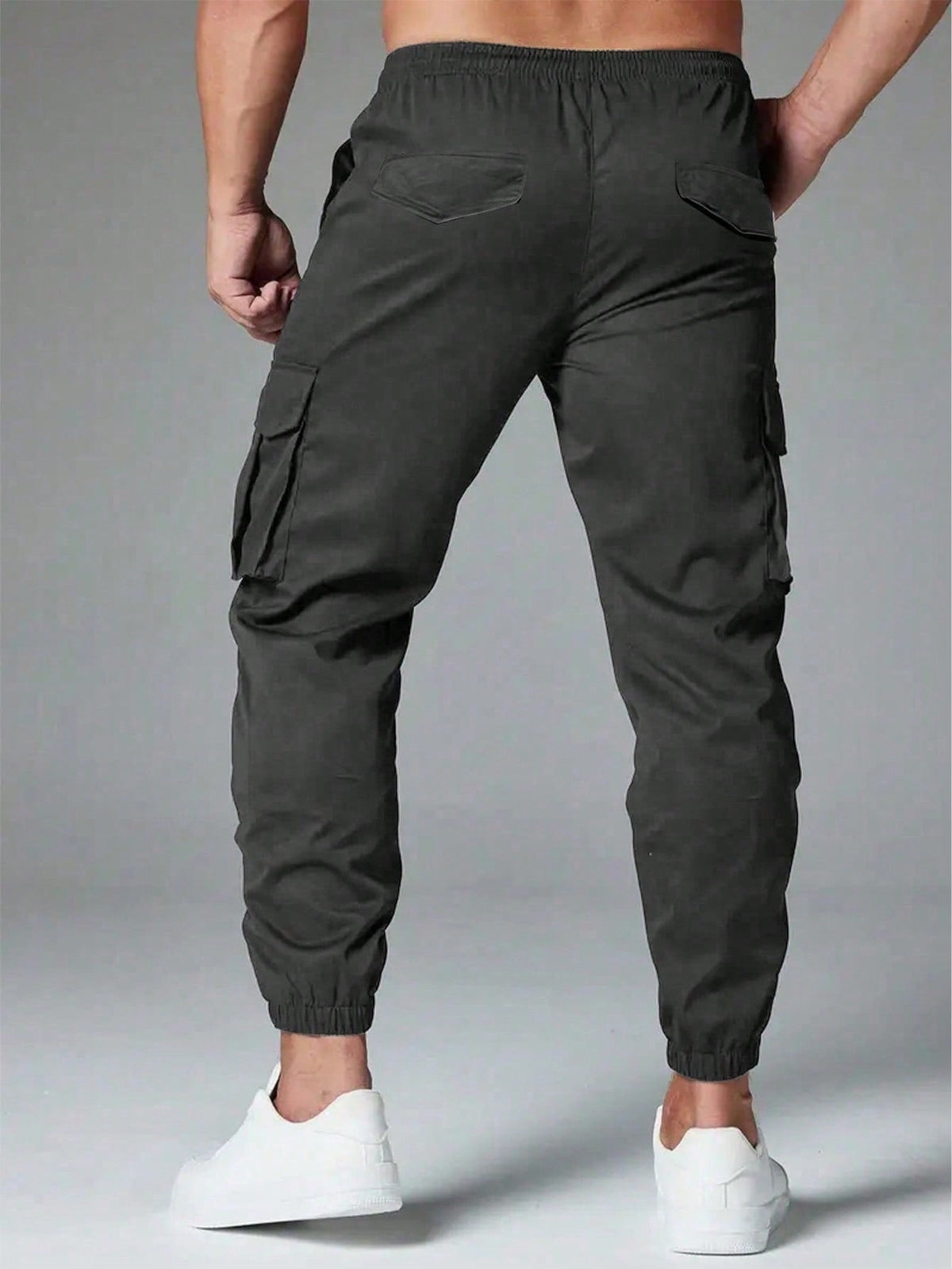 Cargo trousers for men with a drawcord waist, thigh flap pockets and elastic cuffs at the ankle - view 8