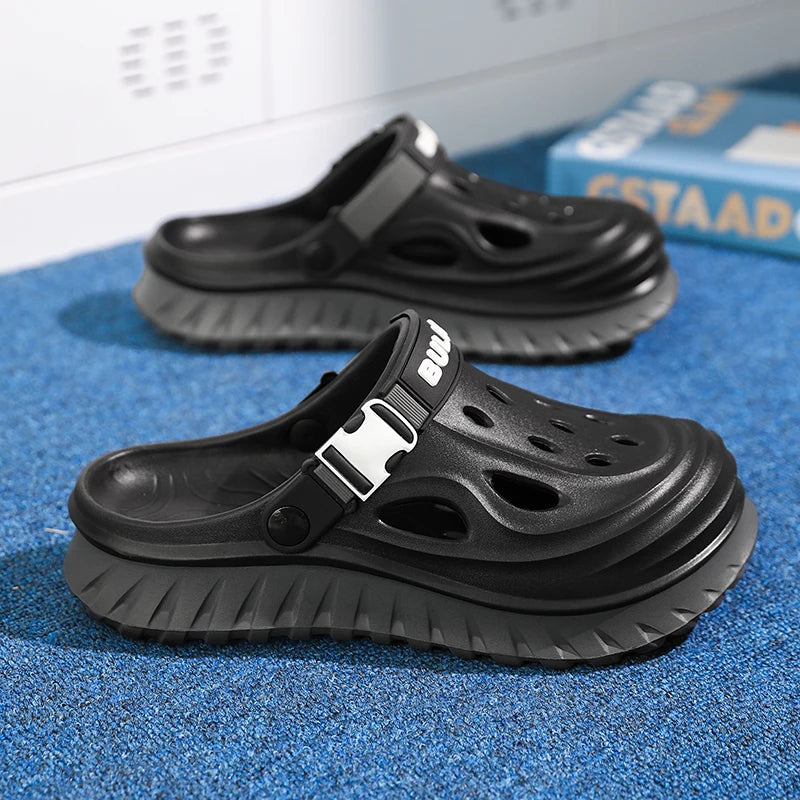 EVA clogs with a high sole, closed toe, vent holes and buckle heel strap - black
