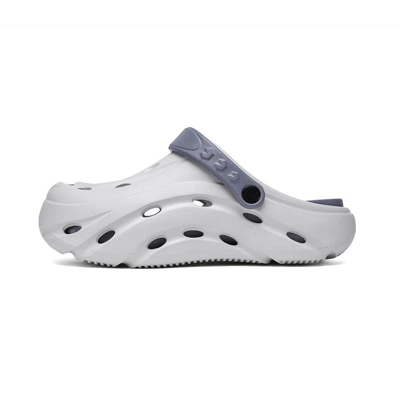 EVA clogs with a closed toe, vent holes, thick sole and pivoting heel strap - light grey
