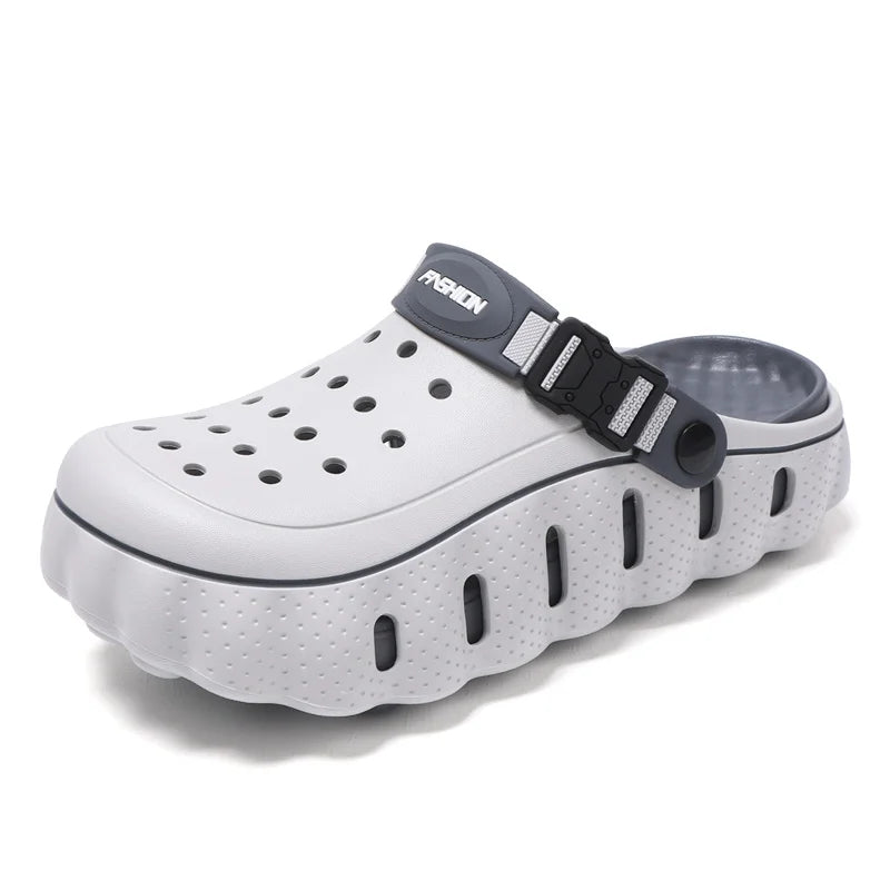 EVA clogs with a closed toe, thick scalloped sole and buckle heel strap - light grey