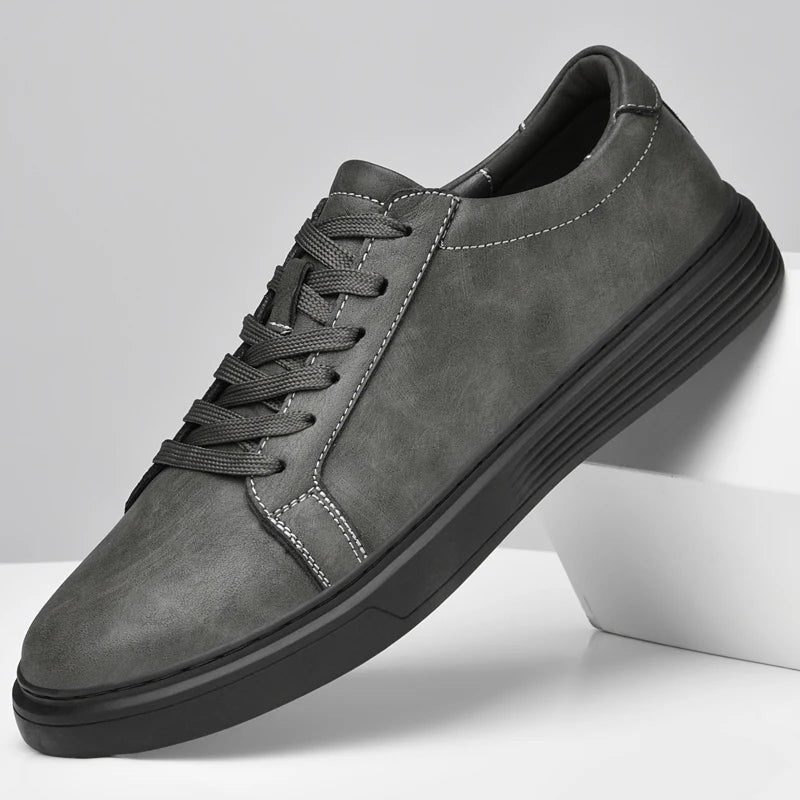 Men's matte faux leather trainers with white contrast stitching and a ribbed cupsole - grey