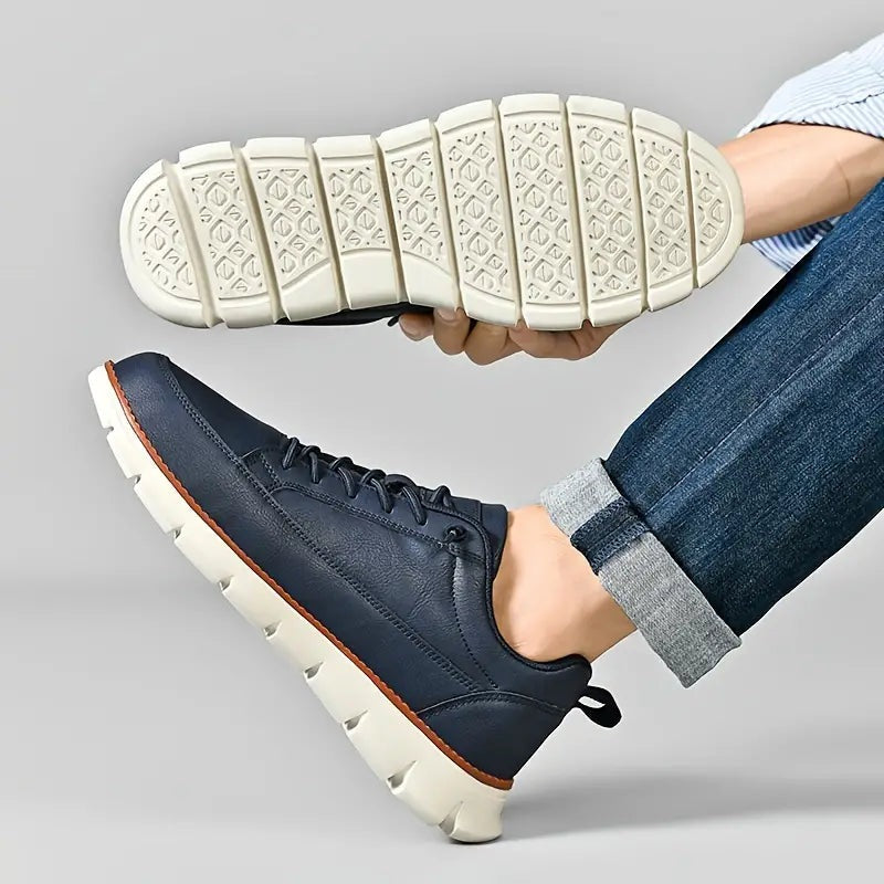 Men's smooth faux leather trainers with a flexible grooved sole and tan welt - view 3