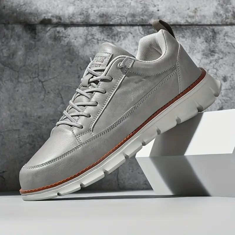 Men's smooth faux leather trainers with a flexible grooved sole and tan welt - light grey
