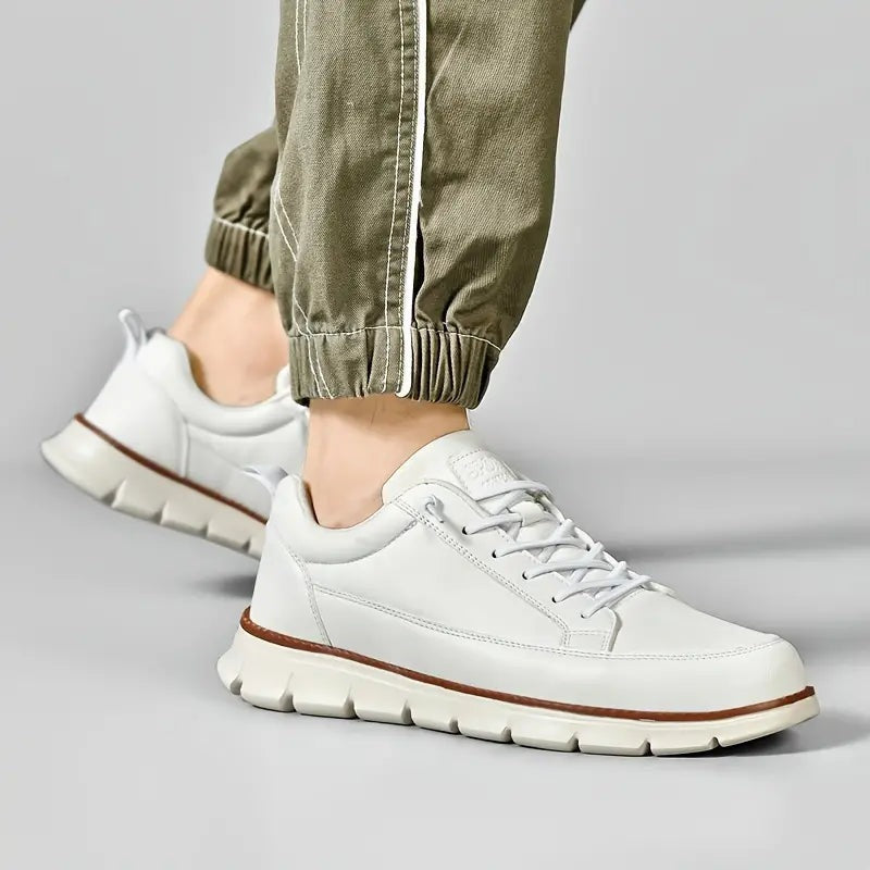 Men's smooth faux leather trainers with a flexible grooved sole and tan welt - view 9