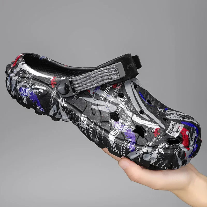 Men's garden clogs in EVA with an all-over graffiti print, vent holes and pivoting heel strap