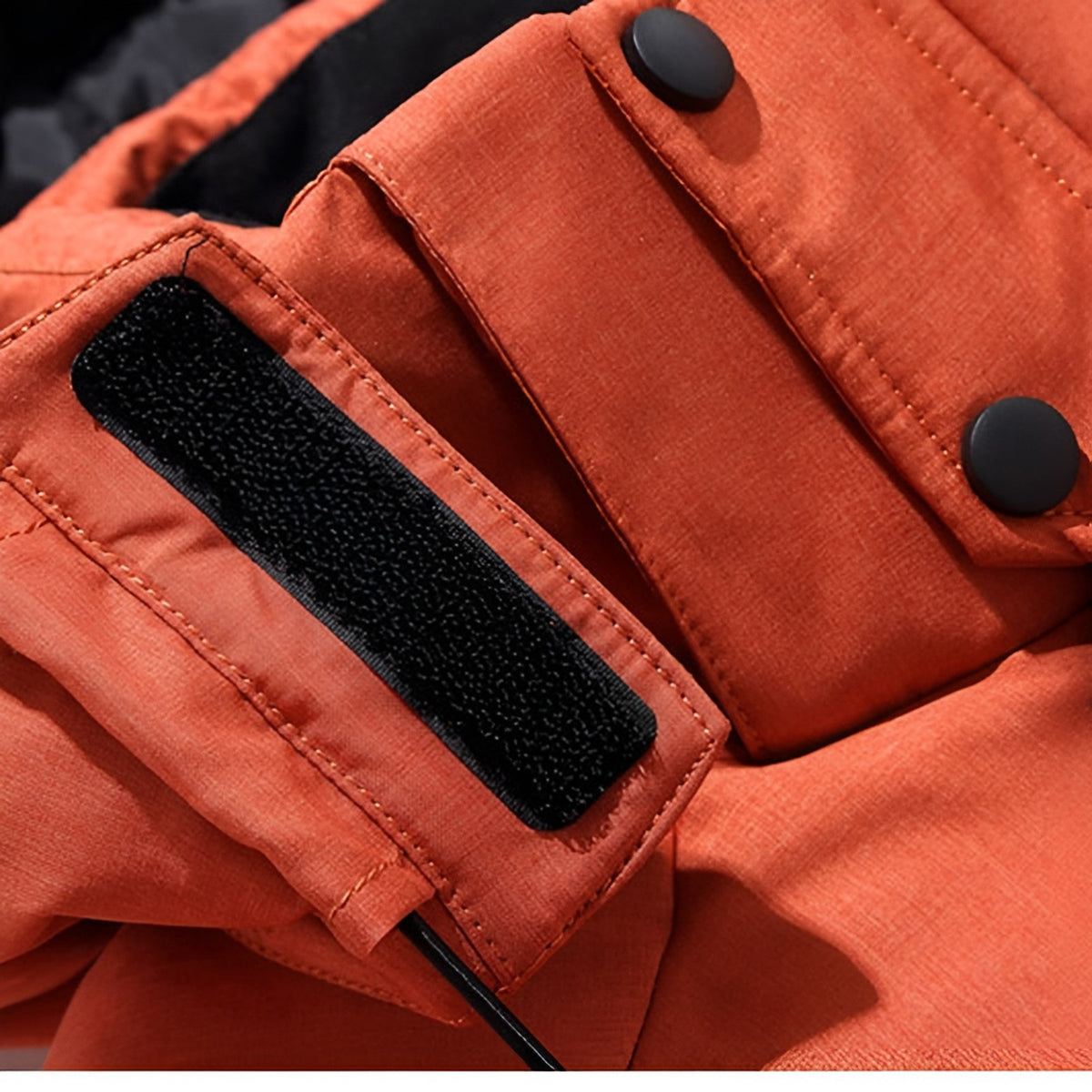 Men's hooded puffer jacket with wide quilted panels, zipped chest pockets and adjustable cuffs