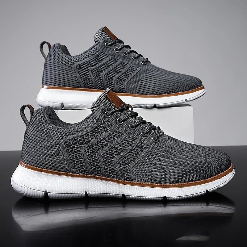 Men's knit trainers with an open chevron pattern, lightweight sole and faux leather tab - dark grey