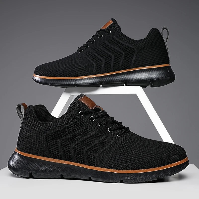 Men's knit trainers with an open chevron pattern, lightweight sole and faux leather tab - all black