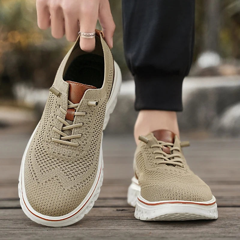 Men's knit mesh trainers with a faux leather heel, red trim along the sole and elastic laces - view 6
