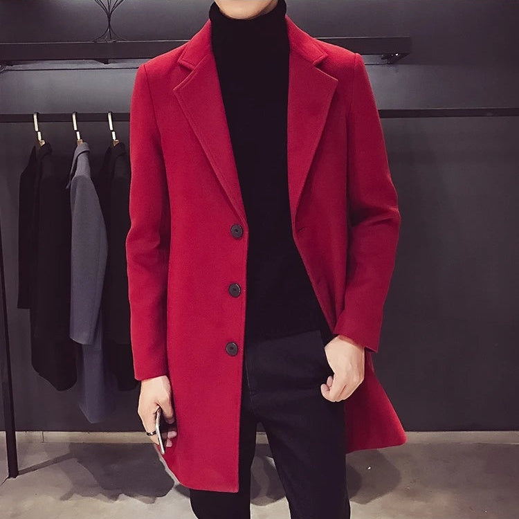 Men's red longline coat worn over a black roll neck
