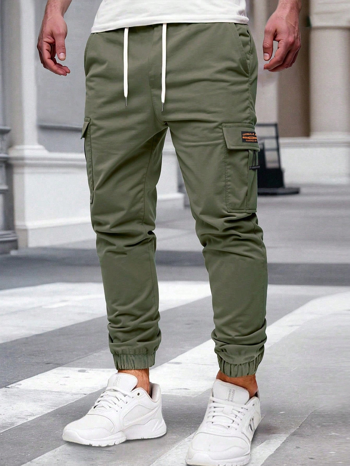 Relaxed cargo joggers for men with a drawcord waist, thigh flap pockets and cuffed ankles - olive