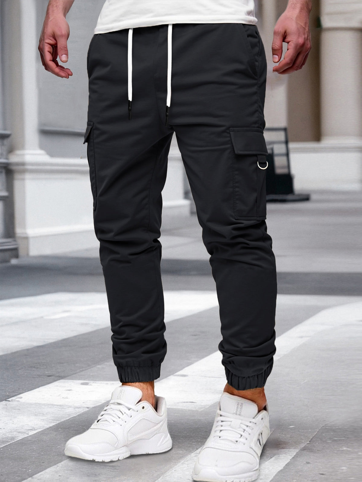 Relaxed cargo joggers for men with a drawcord waist, thigh flap pockets and cuffed ankles - black