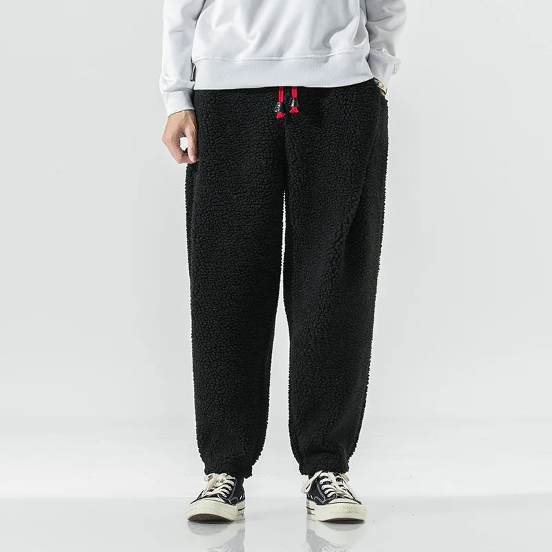 Men's teddy fleece joggers with a red drawcord and elasticated ankle cuffs - black