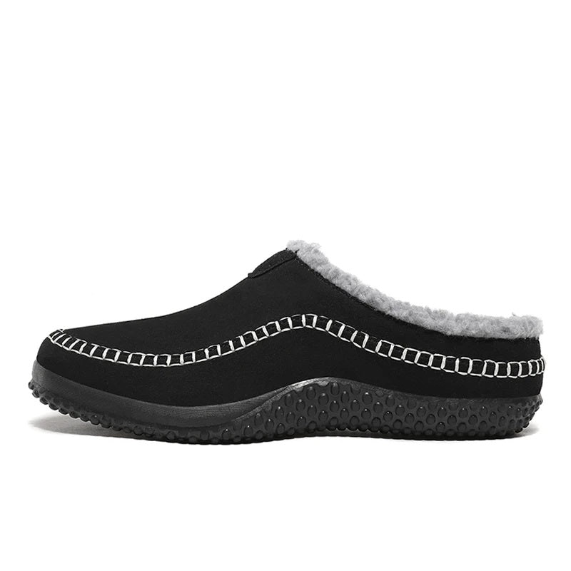 Men's mule slippers in a suede look with teddy lining and whipstitch trim along the sole - black