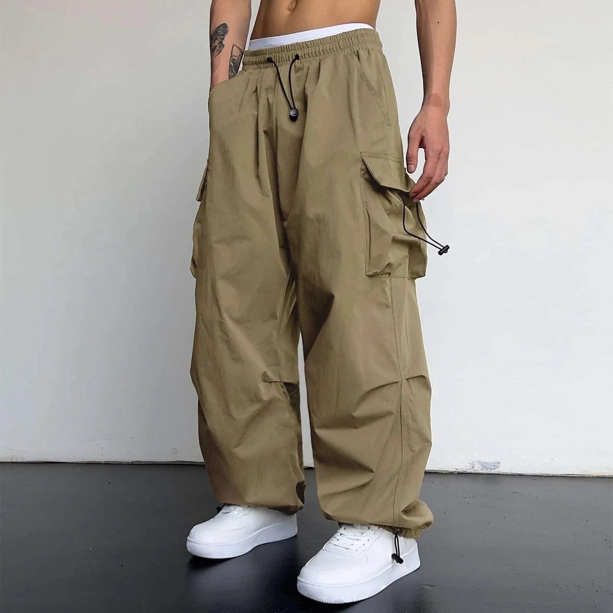 Men's wide-leg cargo trousers with a drawcord waist, flap pockets and adjustable ankles - khaki