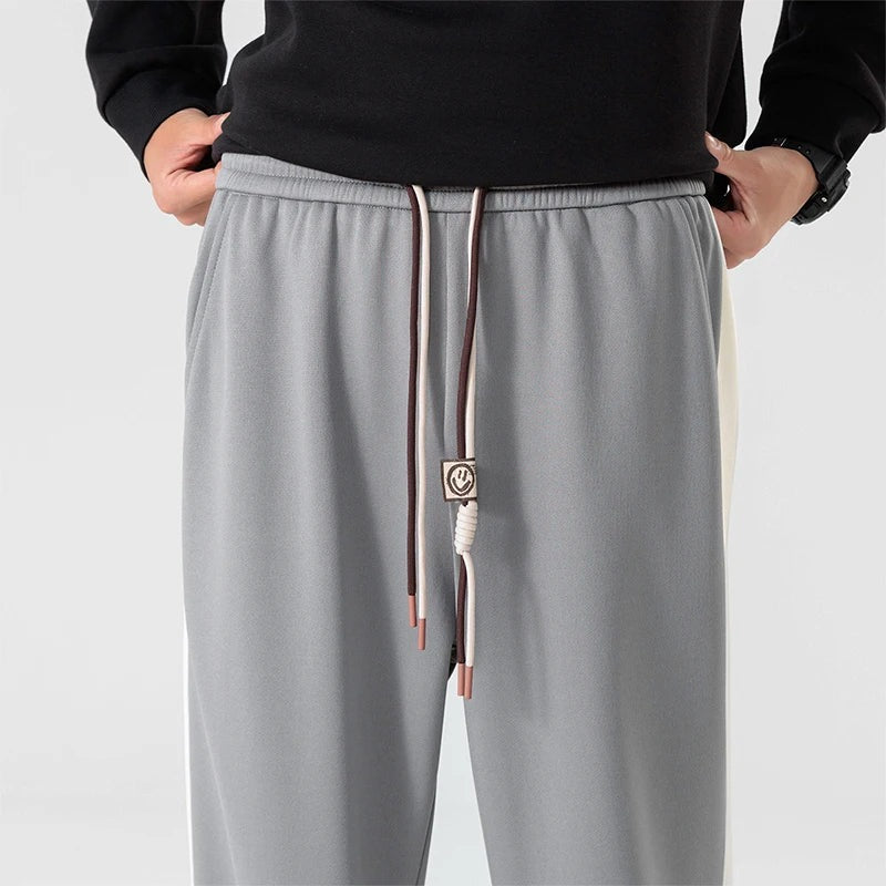Men's wide-leg joggers with a wide contrast stripe along the outer seam and a drawcord - view 2
