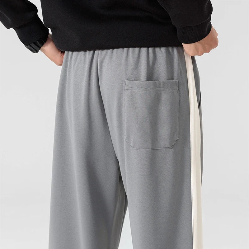 Men's wide-leg joggers with a wide contrast stripe along the outer seam and a drawcord - view 5