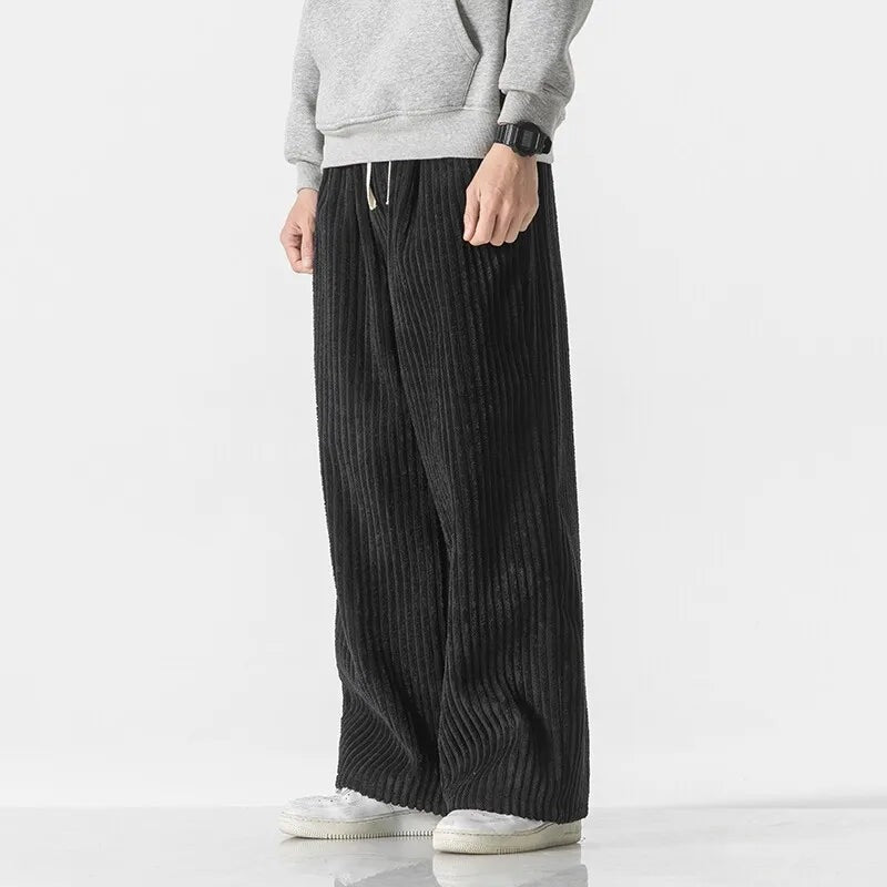 Men's wide-leg jumbo cord trousers with a drawcord waist and patch back pocket - black