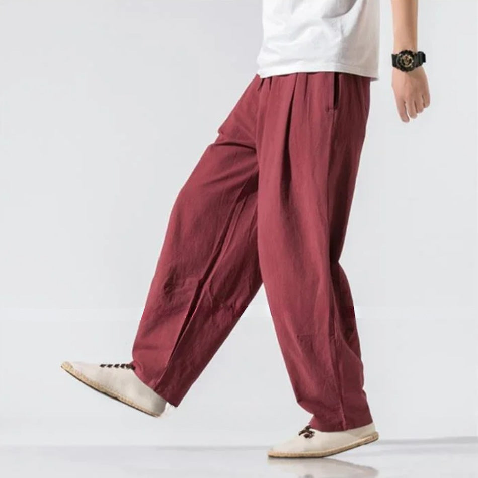 Men's wide-leg linen blend trousers with an elasticated drawstring waist and pleats - burgundy