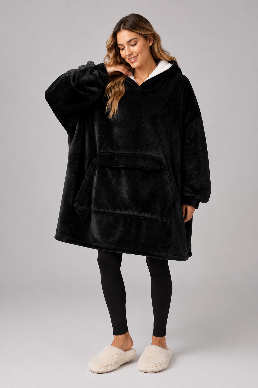 Oversized black blanket hoodie with a lined hood and full width pocket