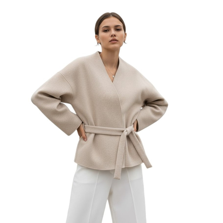Collarless wrap jacket in a felted cloth with wide sleeves and a tie belt in oat