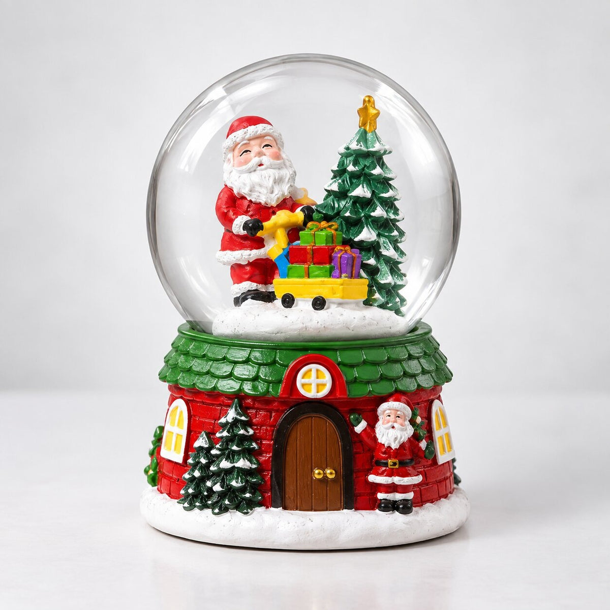 Musical glass snow globe with Santa on a Christmas house base - santa with presents