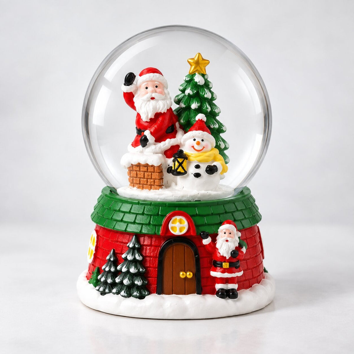 Musical glass snow globe with Santa on a Christmas house base - santa by the chimney