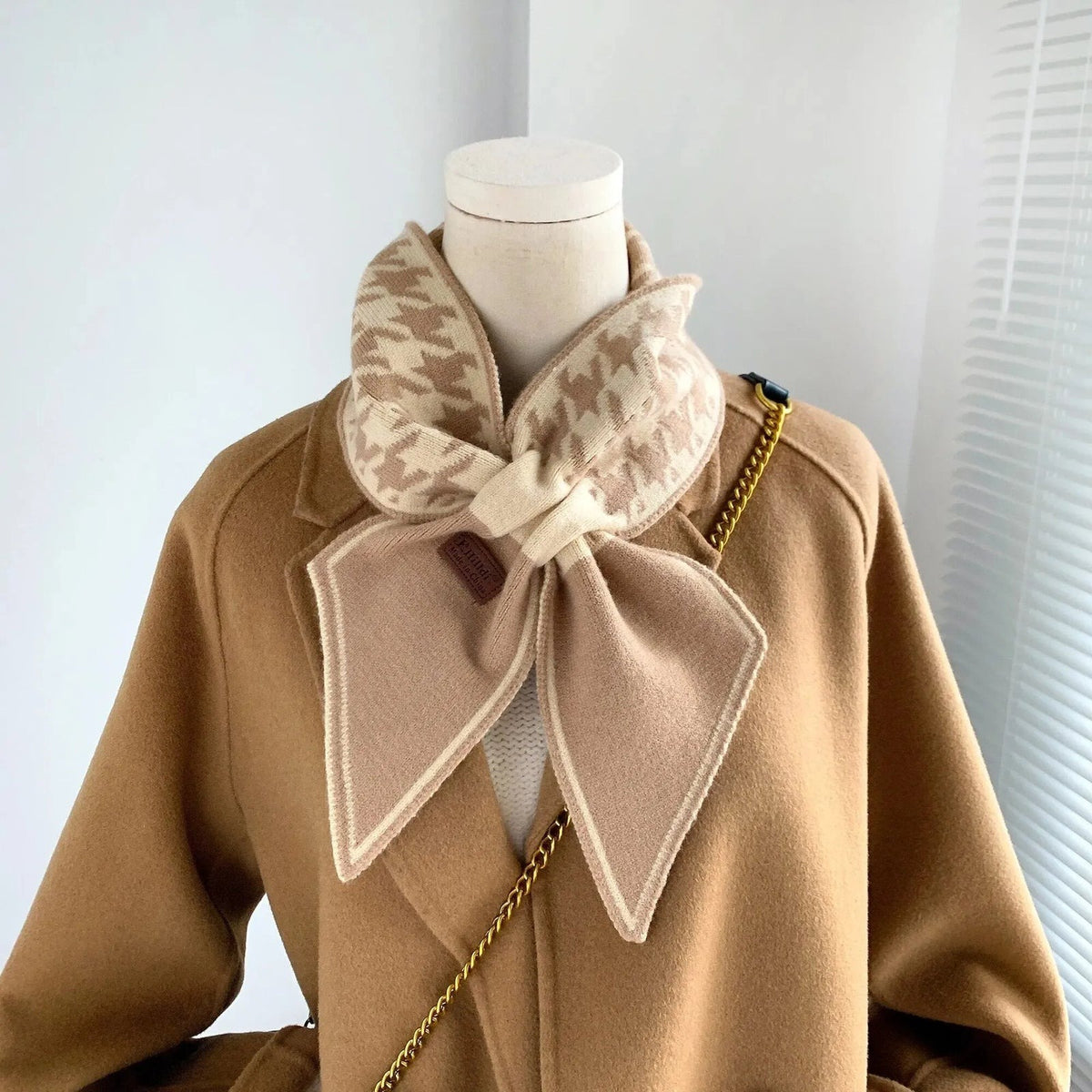 Women's narrow knitted scarf slipped through a small loop, with two plain pointed ends - beige