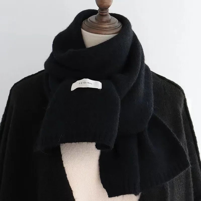 Women's narrow knitted scarf with ribbed ends and a small white label - black