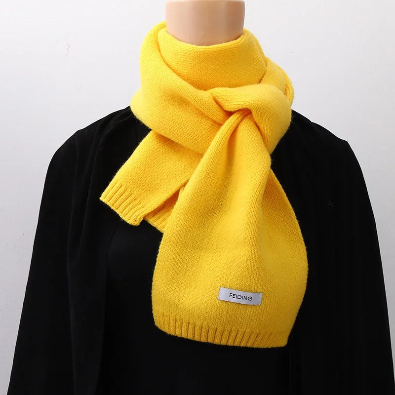 Women's narrow knitted scarf with ribbed ends and a small white label - yellow