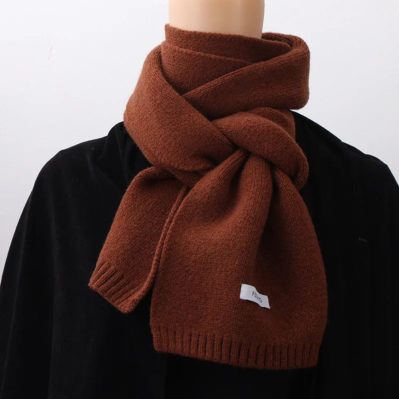 Women's narrow knitted scarf with ribbed ends and a small white label - brown