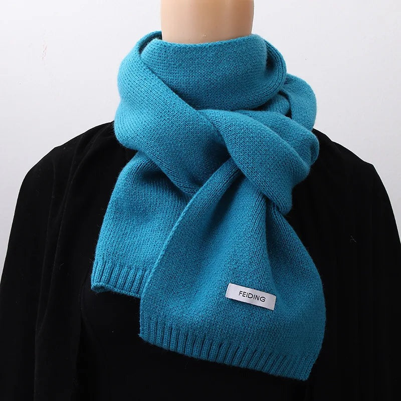 Women's narrow knitted scarf with ribbed ends and a small white label - teal blue