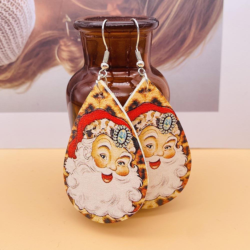 Faux leather Christmas drop earrings with a festive print on silver-tone hooks