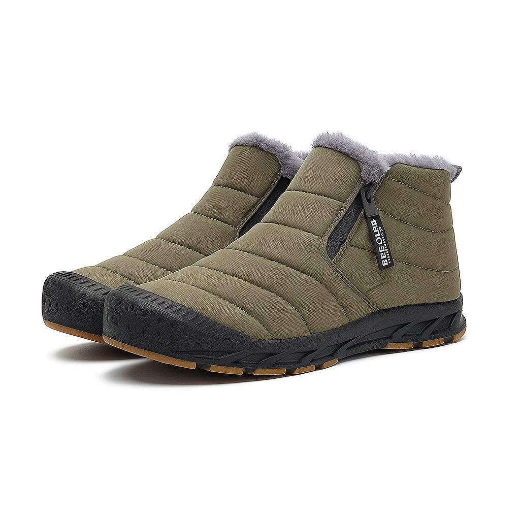 Unisex quilted ankle boots with a side zip and a gum tread sole in olive