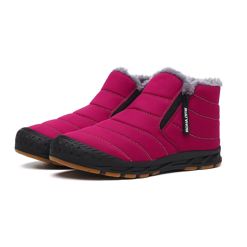 Unisex quilted ankle boots with a side zip and a gum tread sole in pink