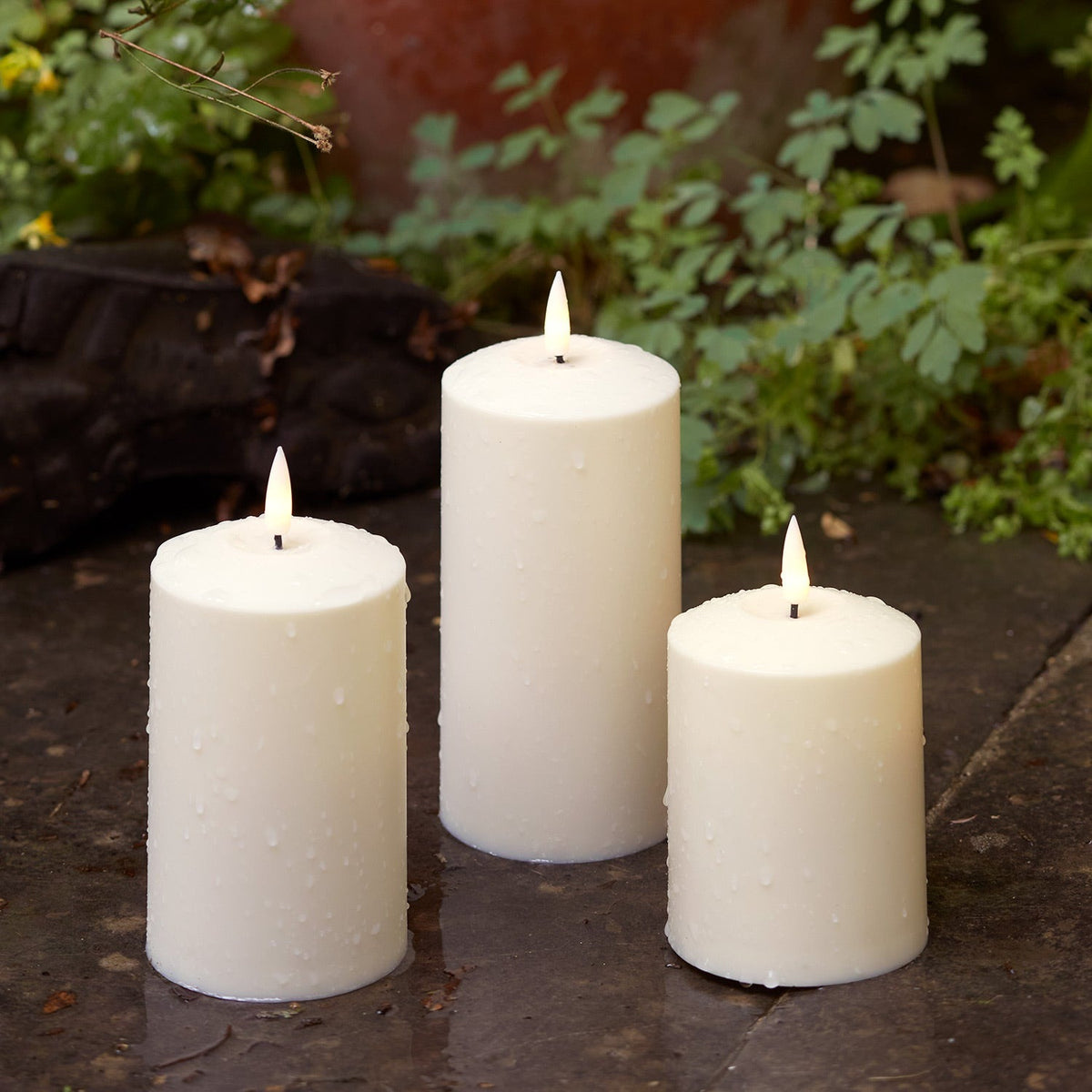 Three ivory outdoor LED candles with a flickering flame and timer - view 2
