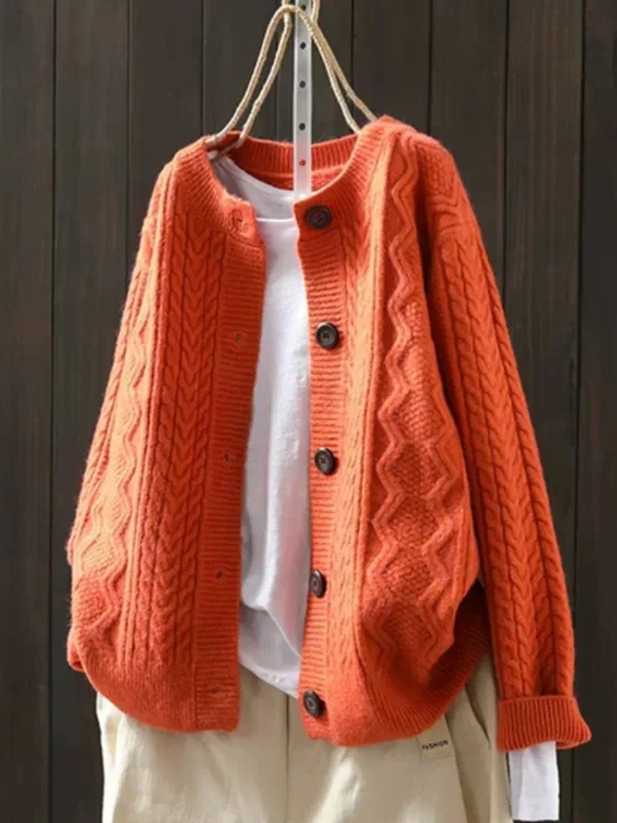 Women's oversized cable knit cardigan with a crew neck and button front - orange
