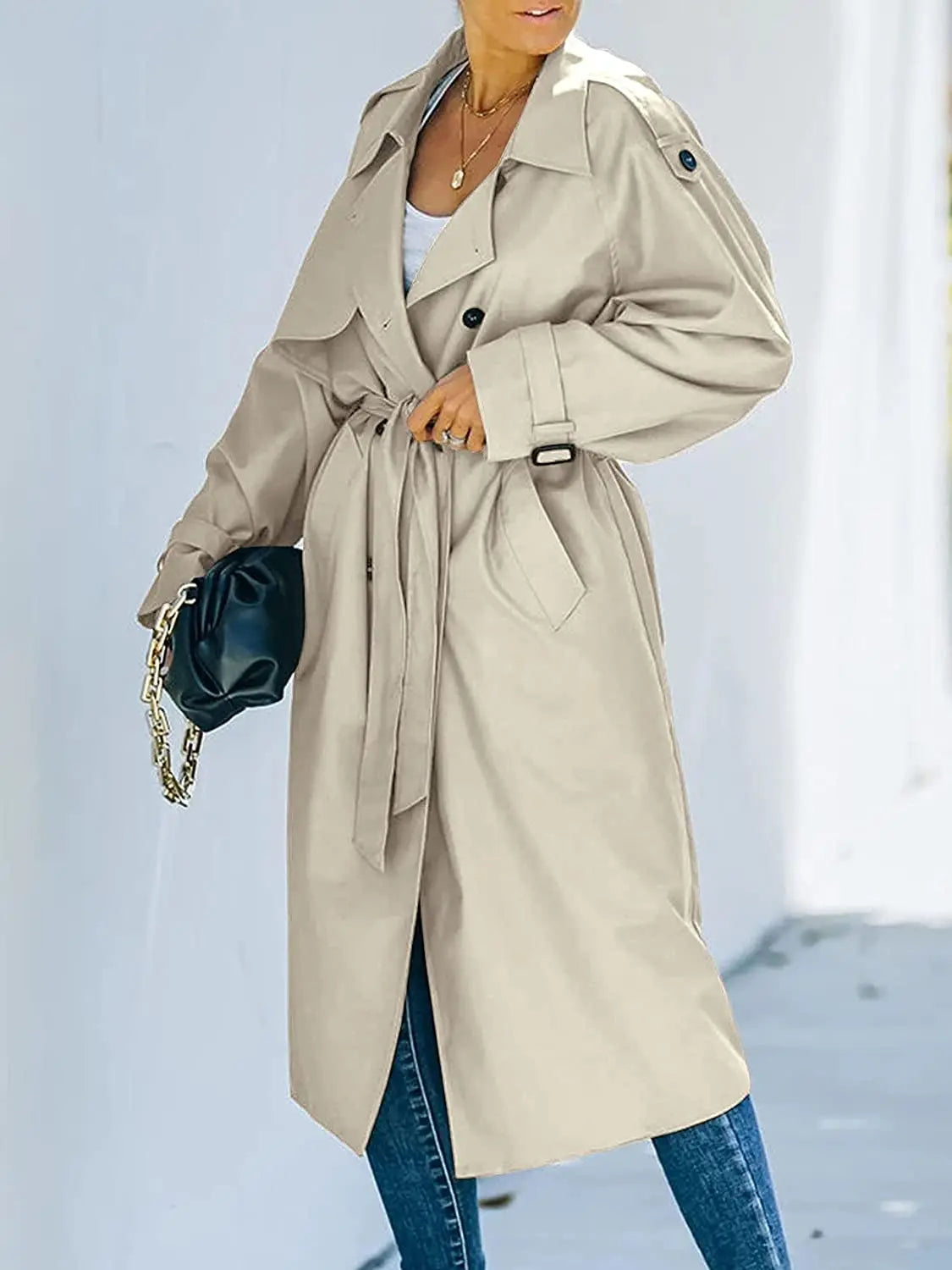 Women's oversized double-breasted trench coat with a tie belt and epaulettes