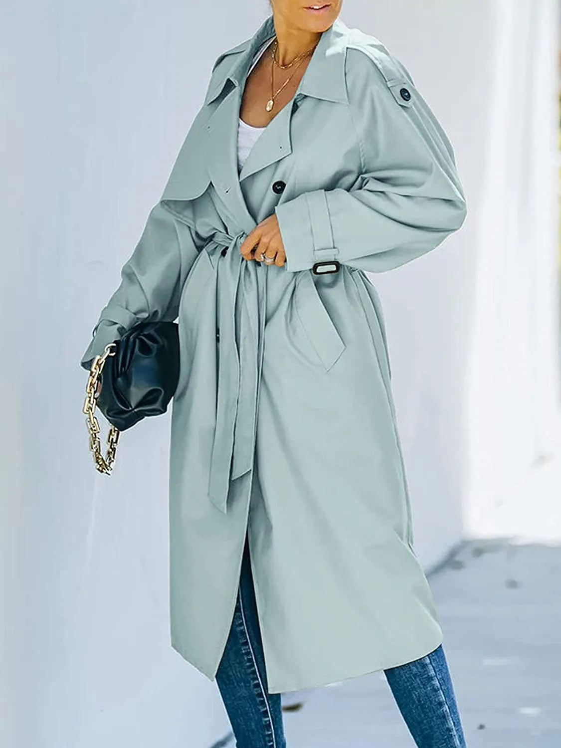 Women's oversized double-breasted trench coat with a tie belt and epaulettes