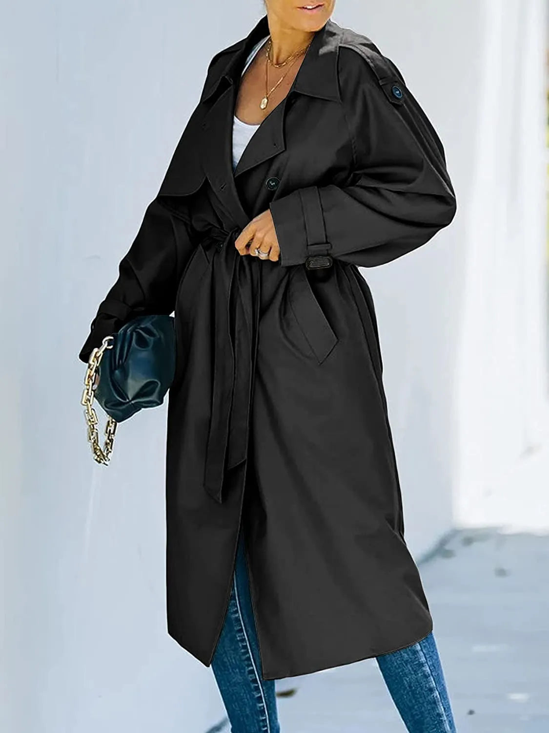 Women's oversized double-breasted trench coat with a tie belt and epaulettes