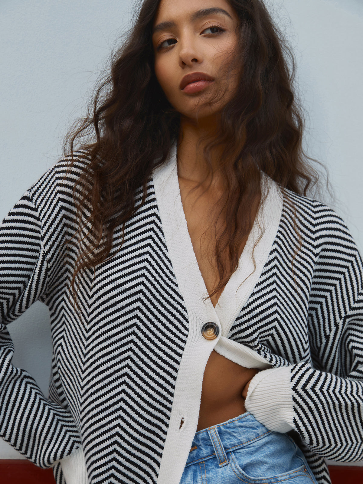 Women's oversized herringbone stripe cardigan with a V-neck and contrast trim