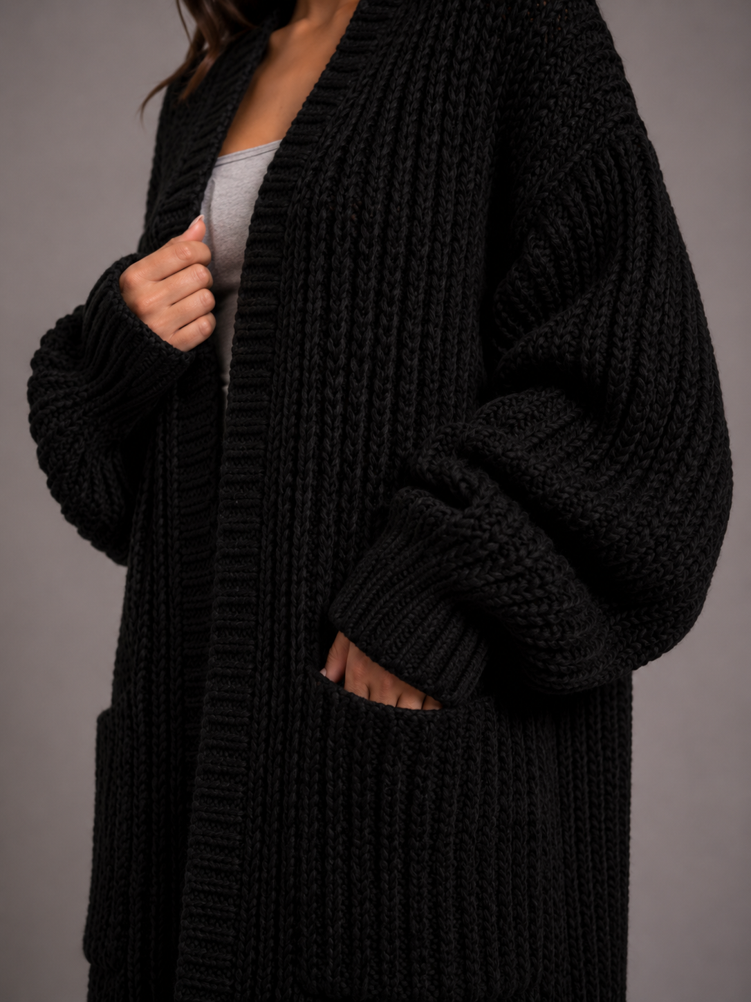 Women's oversized longline cardigan in a chunky knit with an open front and pockets
