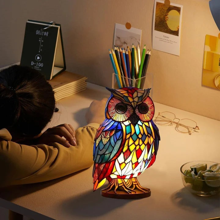 Owl lamp in a stained glass look with red, blue and yellow panels on a round base