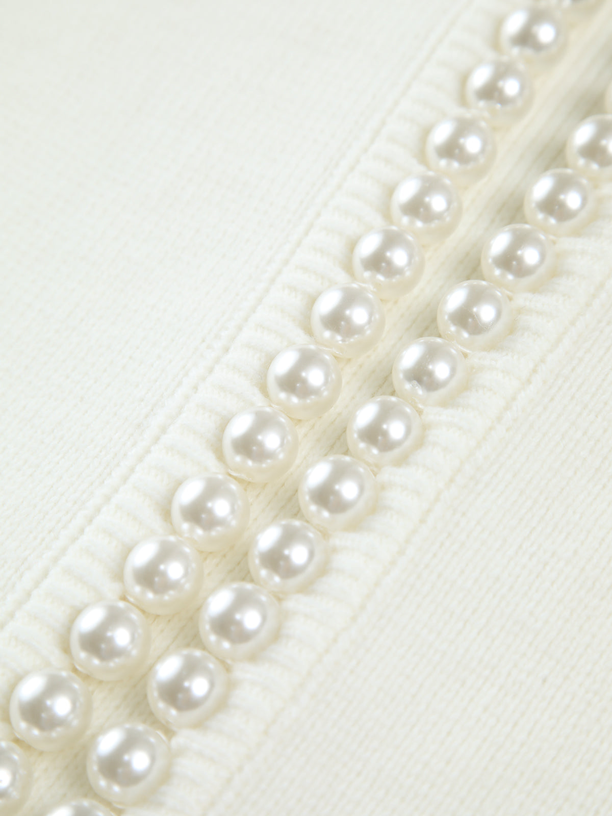 Women's short cardigan with a round neck, pearl trim and balloon sleeves