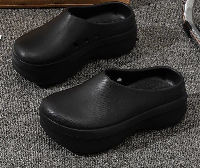 Platform clogs in EVA with a closed toe, open back and thick sole - black