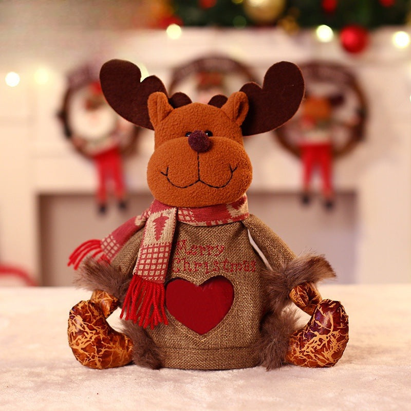 Seated plush Christmas figure with hat, scarf and a heart-shaped window in the body - reindeer