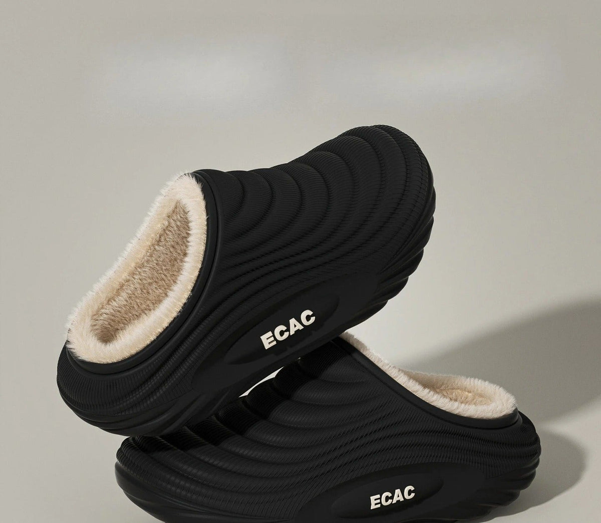 Plush-lined EVA slippers with fine wave ribbing and a thick sole - black open back