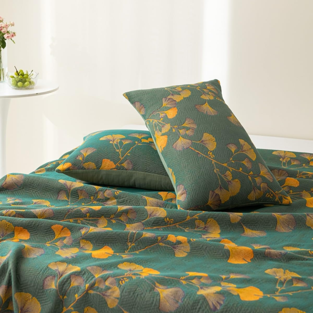 Quilted bedspread with a ginkgo leaf print on a made bed - view 3