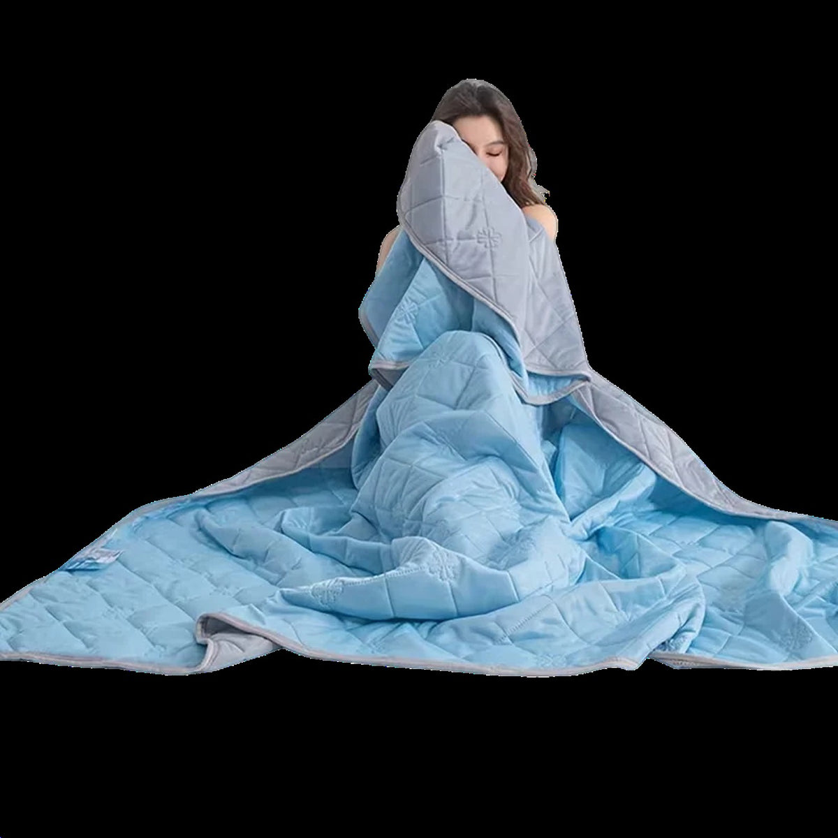 Quilted cooling blanket with diamond stitching and a grey underside on a bed - view 2