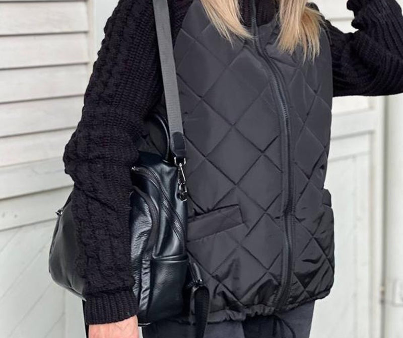 Women's quilted jacket with cable knit sleeves and a high collar - black